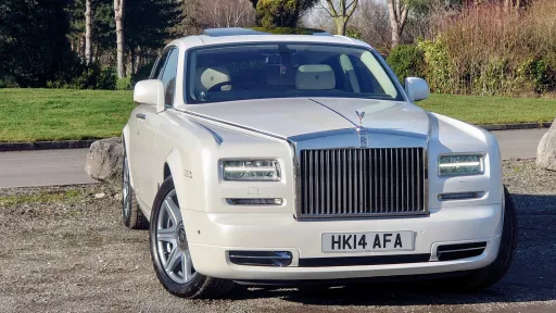 White Modern Rolls-Royce at a wedding venue in North Wales